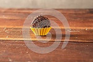 Typical brazilian brigadeiros, over wooden board photo