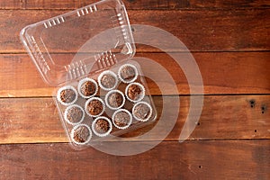 Typical brazilian brigadeiros, various flavors over wooden board photo