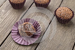 Typical brazilian brigadeiros, various flavors over wooden table