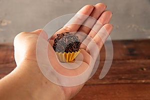 Typical Brazilian Brigadiers, hands holding photo