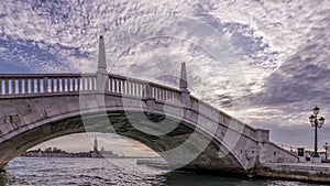 A typical bridge in the historic center of Venice, Italy, under which you can see the island of San Giorgio Maggiore