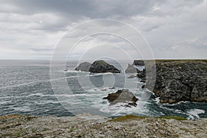 Typical brittany coastline with grey cloudy sky and immensity of atlantic ocean