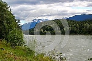 Typical Canada: River leads through beautiful mountain scenery