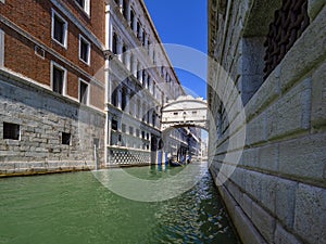 Typical canal of Venice with gondoliers