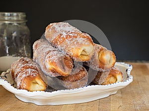 Typical Catalan pastry, xuxo de crema filled with custard photo
