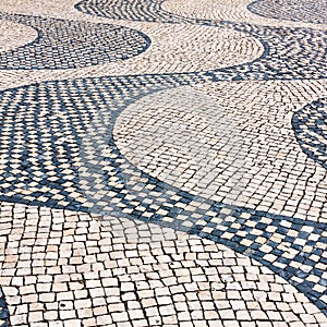 Typical cobblestone pavement iin Lisbon, Portugal