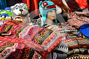 Typical colorful Andean clothing at open air market