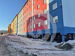 A typical colorful house in permafrost area, sunny weather