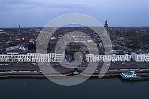 Typical countenance cityscape river IJssel passing Hanseatic tower town