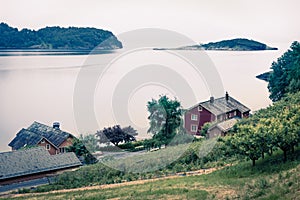 Typical countryside Norwegian landscape. Misty summer morning in Norway, Europe. Beauty of countryside concept background.