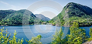 Typical countryside Norwegian landscape. Sunny summer panorama of Norway, Europe. Beauty of countryside concept background.