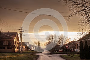 Typical countryside road in the village of Banatsko novo selo, a serbian village of the Banat region of Vojvodina, Serbia, at dusk