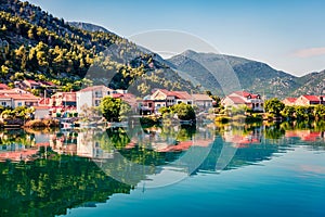 Typical Croatian countreside view with calm sea and sunny morning. Colorful summer seascape of Adriatic sea, Slano willage locatio