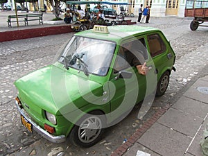 Typical Cuban Taxi and taxi-driver thumb