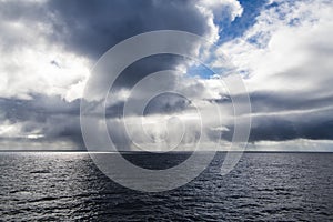 Cumulonimbus clouds bringing rain