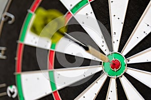 a typical darts game with dart in the bullseye