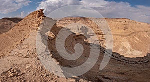 Typical desert landscape with dry river bends and high mountain slopes in Negev.