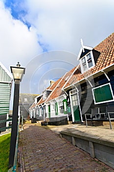 Typical Dutch houses with gardens in village Marken