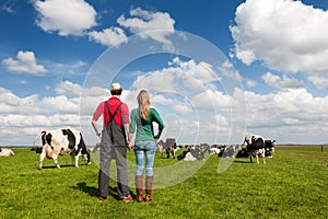 Typical Dutch landscape with farmers couple