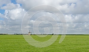 Typical Dutch landscape with old windmill