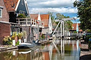 Typical dutch white wooden drawbridge. Architecture for over channels, ditches or rivers in old villages or cities