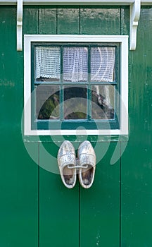 Typical dutch window with wooden clogs