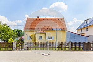 Typical elderly house in housing area in a suburban street of Munich, Germany