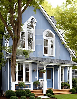 A typical European multi-story house made of wood and blue in color.