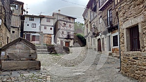 Typical facades and cobbled street in the town of La Alberca, in Salamanca photo