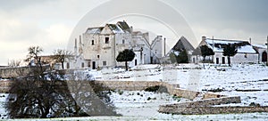 A typical farm of Apulia (masseria) after heavy snow