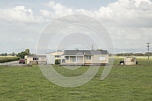 Typical farm house on a rural farmland in New Zealand