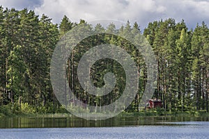 Typical Finnish cottages in the woods, Punkaharju, Lake District, Finland