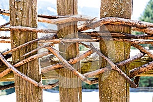 Typical fixation of a wooden fence in the Italian Alps