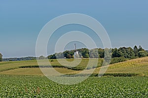 Typical flemish farm landscape with historic windmill