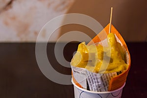 Typical French fries, deep fried Homemade Baked potato chips. Close up with traditional dutch spicy sauce