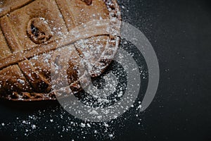 Typical Galician artisan pie, with decoration of puff pastry of puff pastry and sprinkled flour photo