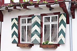 Typical german architecture - Green and white traditional window shutters