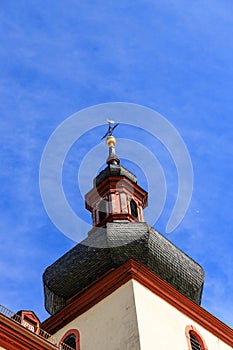 Typical german catholic church tower in front of blue sky in Nierstein, Rheinhessen