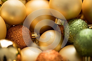 Typical German glass Christmas tree decoration, balls and ornaments in gold, bronze and green with matt, glitter and shiny finish