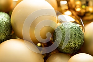 Typical German glass Christmas tree decoration, balls and ornaments in gold and green with matt, glitter and shiny finish