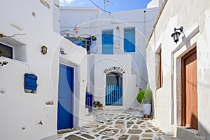 Typical Greek house with blue windows and doors