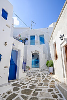 Typical Greek house with blue windows and doors