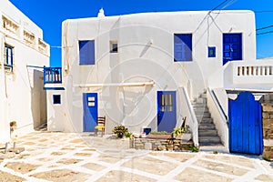 Typical Greek house blue windows and doors on whitewashed street in beautiful Mykonos town, Cyclades islands, Greece