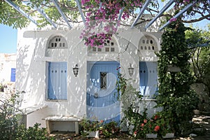 Typical greek island whitewashed house veranda in Tinos, Greece