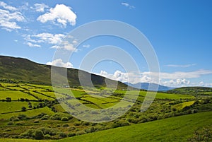 Typical green Irish country side with blue sky and cluds photo