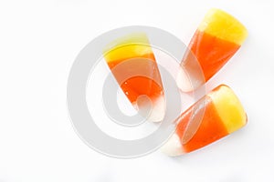 Typical halloween candy corn isolated on white background. Top view.