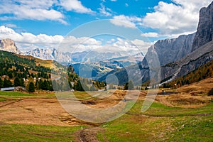 Typical hilly mountain landscape in the Dolomites with beautiful autumn colors on a foggy morning near the town of Cortina dâ€™