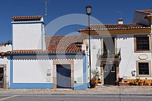 Typical house with fireplace in the village of Flor da Rosa, Crato, Alentejo region, Portugal photo