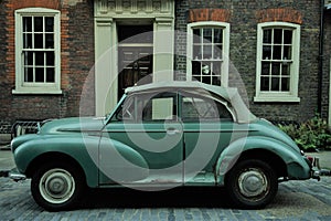 Typical brick house in Shoreditch London with collection  vintage car
