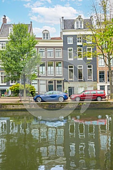 Typical Houses on the Amsterdam Canal and Cars